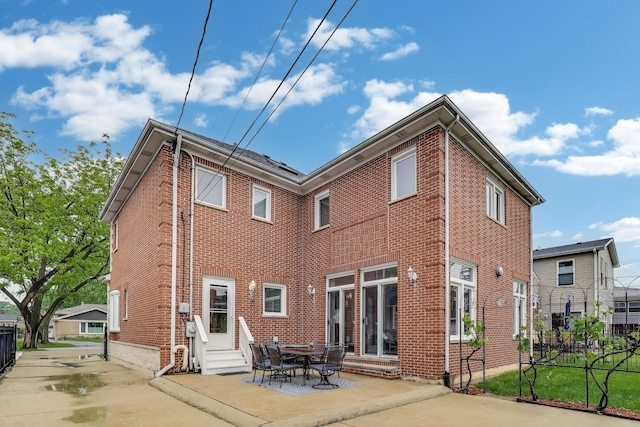 19 S Home Ave, Park Ridge, IL 60068 - rear view of house featuring entry steps, brick siding, and a patio area