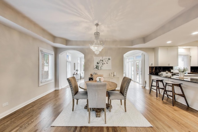 19 S Home Ave, Park Ridge, IL 60068 - dining area with arched walkways, wood finished floors, healthy amount of natural light, and recessed lighting