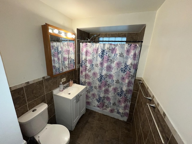 14404 University Ave, Dolton, IL 60419 - full bathroom featuring tile walls, vanity, toilet, curtained shower, and wainscoting