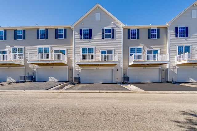 1905 Neubauer Cir Unit 1003, Lindenhurst, IL 60046 - rear view of property with a garage and driveway