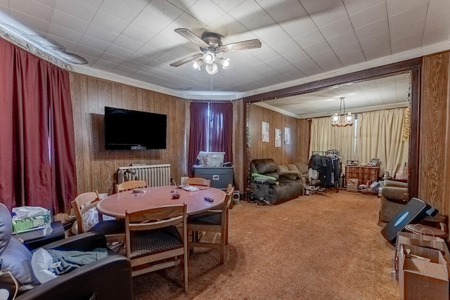 1032 S Maple Ave, Oak Park, IL 60304 - carpeted dining room with a ceiling fan, crown molding, wooden walls, and a chandelier