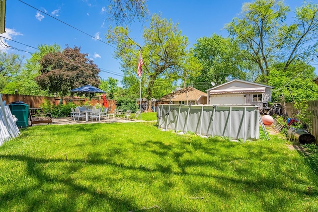1032 S Maple Ave, Oak Park, IL 60304 - fenced backyard featuring a detached garage and a patio area