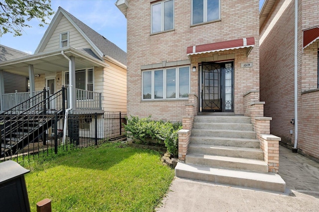 1019 W 47th Pl, Chicago, IL 60609 - property entrance featuring brick siding and a porch