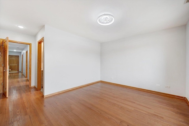 1019 W 47th Pl, Chicago, IL 60609 - unfurnished room with light wood finished floors and recessed lighting