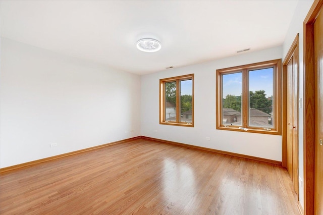 1019 W 47th Pl, Chicago, IL 60609 - empty room with light wood-style floors and baseboards