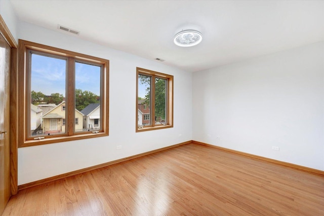 1019 W 47th Pl, Chicago, IL 60609 - spare room with light wood-style floors and baseboards
