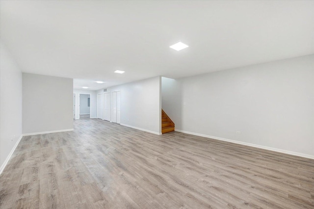 1019 W 47th Pl, Chicago, IL 60609 - unfurnished living room with light wood-type flooring and stairs