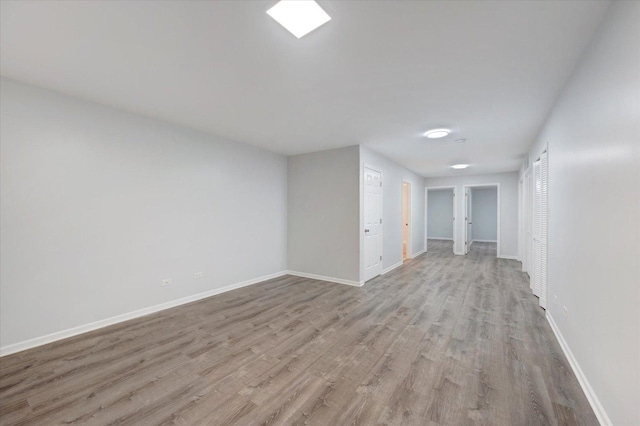 1019 W 47th Pl, Chicago, IL 60609 - empty room featuring light wood-style flooring and baseboards