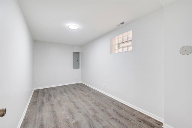 1019 W 47th Pl, Chicago, IL 60609 - spare room with wood finished floors and electric panel