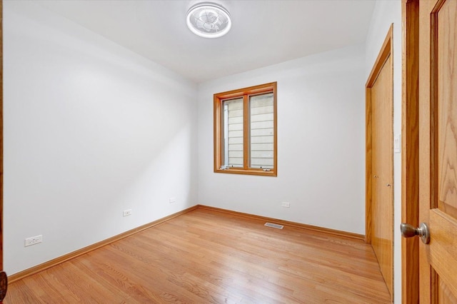 1019 W 47th Pl, Chicago, IL 60609 - spare room featuring light wood-type flooring and baseboards