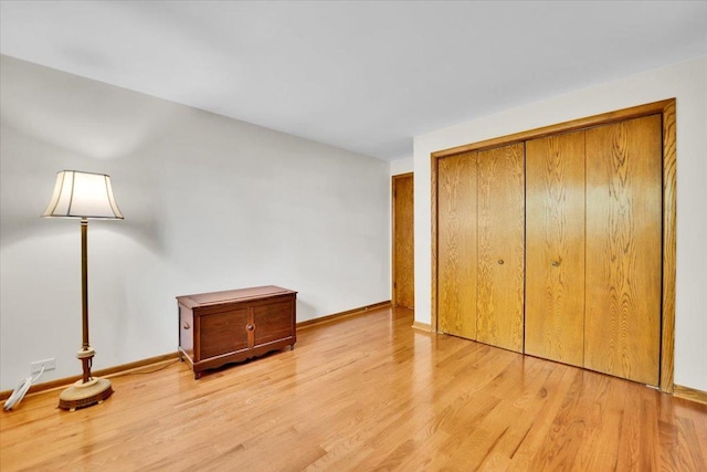 901 E Ardyce Ln, Mount Prospect, IL 60056 - unfurnished bedroom featuring light wood-type flooring and a closet