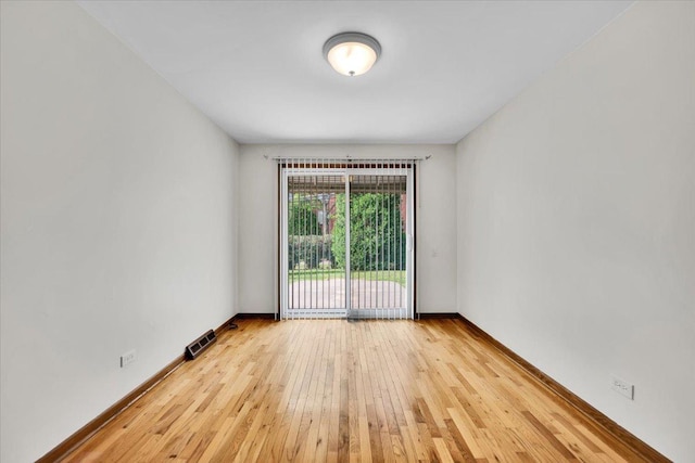 901 E Ardyce Ln, Mount Prospect, IL 60056 - empty room with wood-type flooring and baseboards