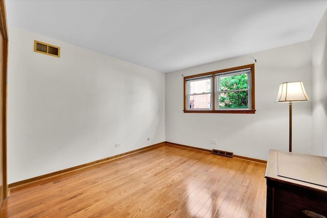 901 E Ardyce Ln, Mount Prospect, IL 60056 - unfurnished room with light wood-type flooring and baseboards