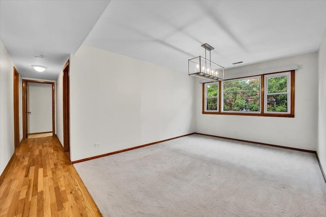 901 E Ardyce Ln, Mount Prospect, IL 60056 - unfurnished room featuring a chandelier and a smoke detector