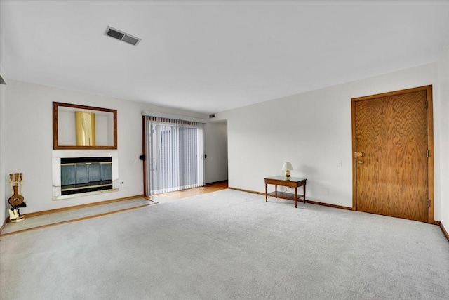 901 E Ardyce Ln, Mount Prospect, IL 60056 - unfurnished living room with carpet flooring and a glass covered fireplace