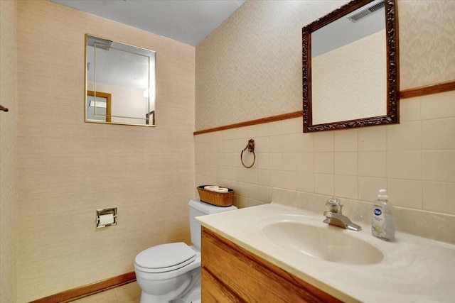 901 E Ardyce Ln, Mount Prospect, IL 60056 - bathroom with vanity, wallpapered walls, and tile walls