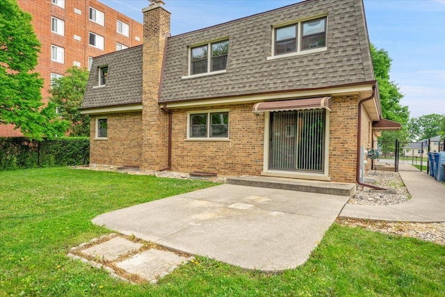 901 E Ardyce Ln, Mount Prospect, IL 60056 - back of house featuring mansard roof, roof with shingles, brick siding, and a gate