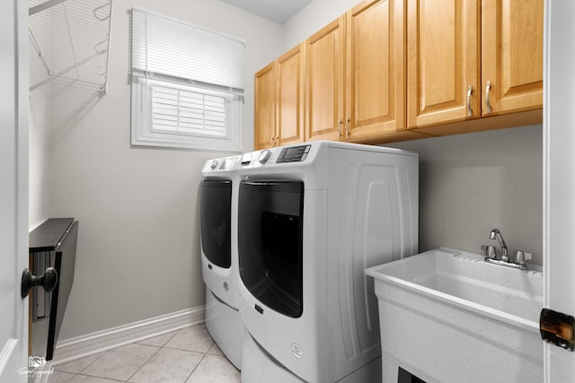 2508 Reflections Dr, Crest Hill, IL 60403 - laundry area with separate washer and dryer, cabinet space, baseboards, and light tile patterned floors