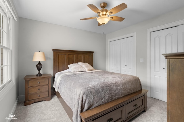 2508 Reflections Dr, Crest Hill, IL 60403 - bedroom featuring light colored carpet, two closets, baseboards, and a ceiling fan