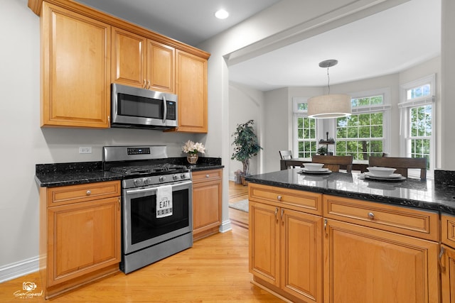 2508 Reflections Dr, Crest Hill, IL 60403 - kitchen with appliances with stainless steel finishes, light wood-style floors, dark stone countertops, and pendant lighting