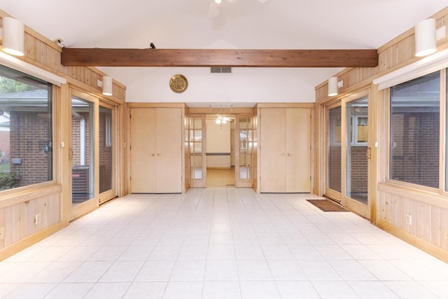 212 Mays Dr, Bloomington, IL 61701 - unfurnished room with a ceiling fan, wooden walls, beam ceiling, and baseboards