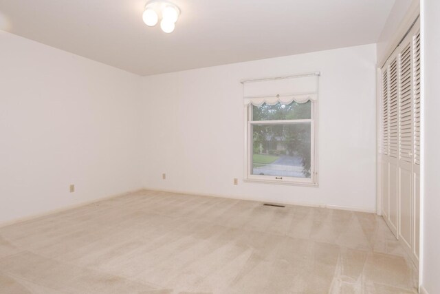 212 Mays Dr, Bloomington, IL 61701 - unfurnished bedroom with carpet floors and a closet