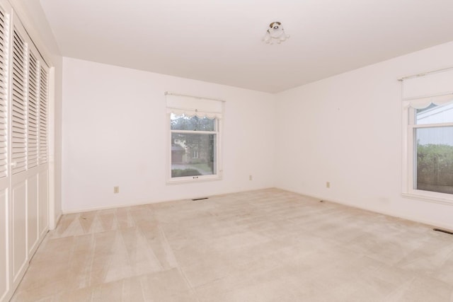 212 Mays Dr, Bloomington, IL 61701 - unfurnished bedroom featuring carpet and a closet