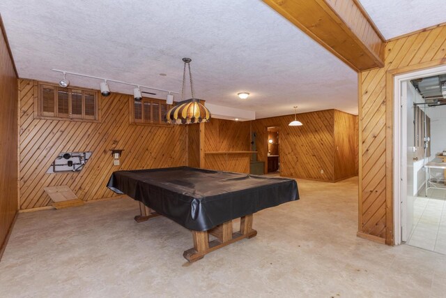 212 Mays Dr, Bloomington, IL 61701 - rec room featuring wooden walls, pool table, rail lighting, and a textured ceiling