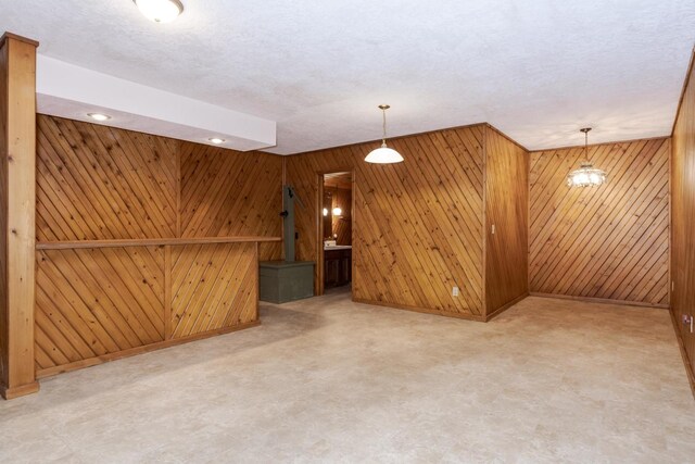 212 Mays Dr, Bloomington, IL 61701 - unfurnished living room with wood walls and baseboards