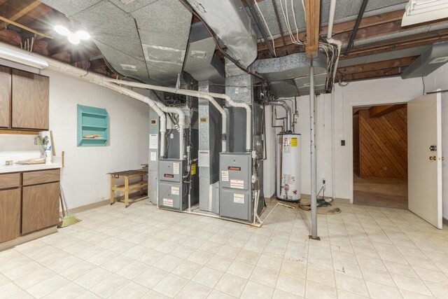 212 Mays Dr, Bloomington, IL 61701 - unfinished basement featuring water heater, heating unit, and light flooring