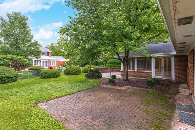 212 Mays Dr, Bloomington, IL 61701 - view of yard with a sunroom and a patio