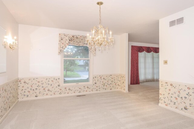 212 Mays Dr, Bloomington, IL 61701 - unfurnished room with a chandelier, light colored carpet, and wallpapered walls