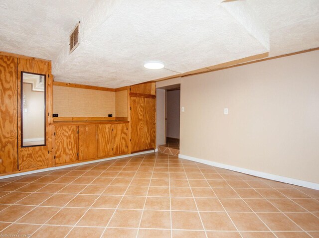 444 S Tanner Ave, Kankakee, IL 60901 - empty room featuring a textured ceiling, crown molding, and light tile patterned floors