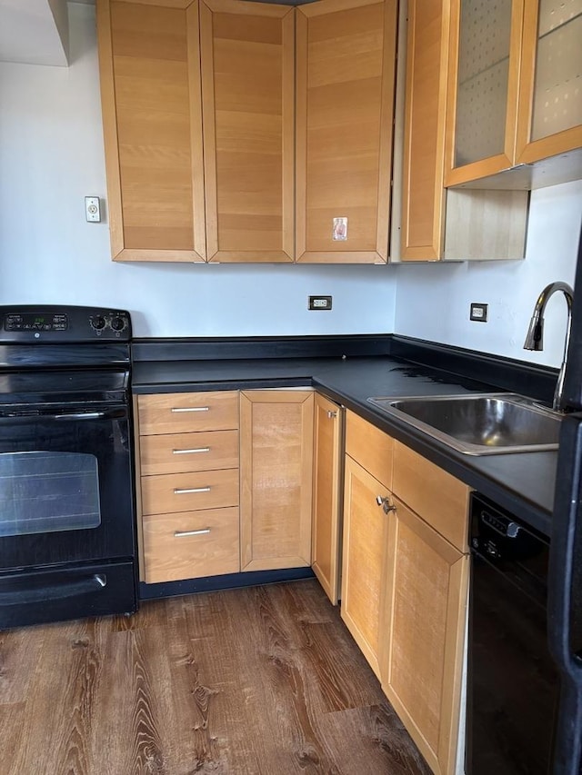 6301 N Sheridan Rd Unit 5H, Chicago, IL 60660 - kitchen featuring black appliances, dark wood-style flooring, dark countertops, light brown cabinets, and glass insert cabinets