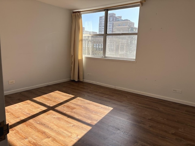 6301 N Sheridan Rd Unit 5H, Chicago, IL 60660 - empty room with wood finished floors and a city view