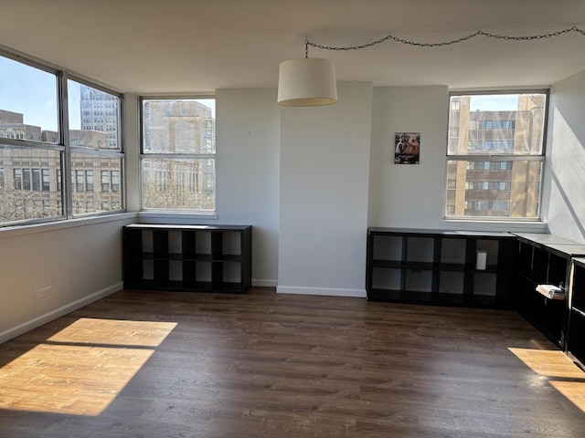 6301 N Sheridan Rd Unit 5H, Chicago, IL 60660 - unfurnished dining area with healthy amount of natural light and wood finished floors