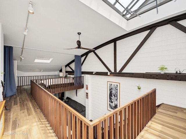 241 E Burlington St Unit A, Riverside, IL 60546 - staircase with a skylight, rail lighting, ceiling fan, and hardwood / wood-style floors
