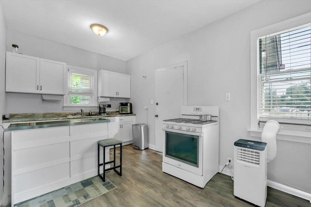10002 S Torrence Ave, Chicago, IL 60617 - kitchen featuring white gas range oven, white cabinetry, and dark wood-style flooring