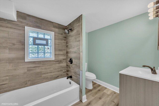 10002 S Torrence Ave, Chicago, IL 60617 - bathroom featuring toilet, vanity, shower / tub combination, baseboards, and wood finished floors