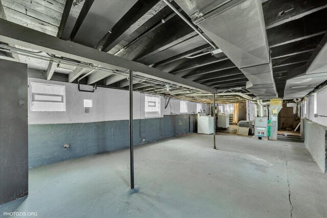 10002 S Torrence Ave, Chicago, IL 60617 - basement featuring heating unit and healthy amount of natural light