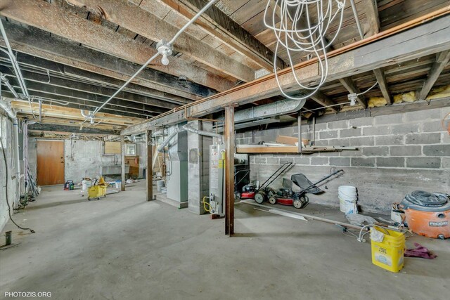 10002 S Torrence Ave, Chicago, IL 60617 - unfinished basement featuring gas water heater and heating unit