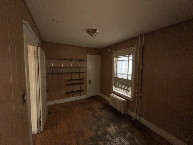 104 Interocean Ave, South Chicago Heights, IL 60411 - spare room with radiator heating unit, baseboards, and wood finished floors