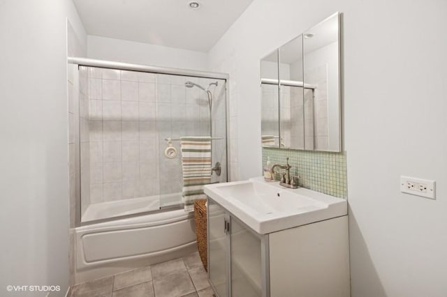 7035 W Greenleaf St, Niles, IL 60714 - full bathroom with vanity, combined bath / shower with glass door, tile patterned flooring, and tasteful backsplash