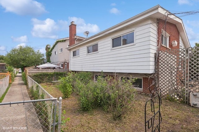 7035 W Greenleaf St, Niles, IL 60714 - rear view of property with brick siding