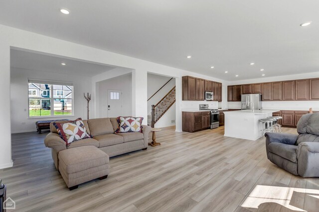 1214 Buckeye Cir, Crystal Lake, IL 60012 - living area featuring light wood-style flooring, stairs, recessed lighting, and baseboards