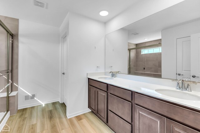 1214 Buckeye Cir, Crystal Lake, IL 60012 - full bath with a shower stall, double vanity, and wood finished floors