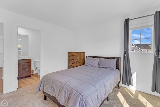 1214 Buckeye Cir, Crystal Lake, IL 60012 - bedroom with carpet flooring, baseboards, a sink, and ensuite bath