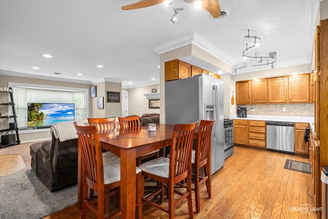 19 Crescent Ct, Montgomery, IL 60538 - dining area featuring crown molding, ceiling fan, light wood-style floors, and recessed lighting