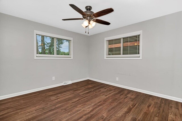 610 W S St, Plano, IL 60545 - empty room featuring dark wood finished floors and a ceiling fan