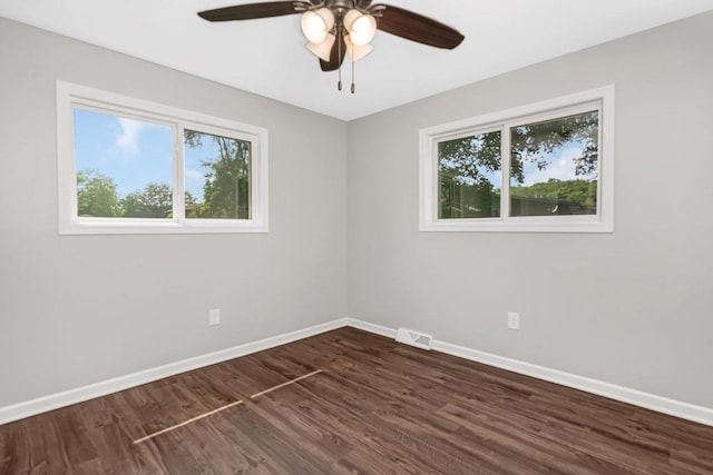 610 W S St, Plano, IL 60545 - spare room with a ceiling fan and dark wood-style flooring